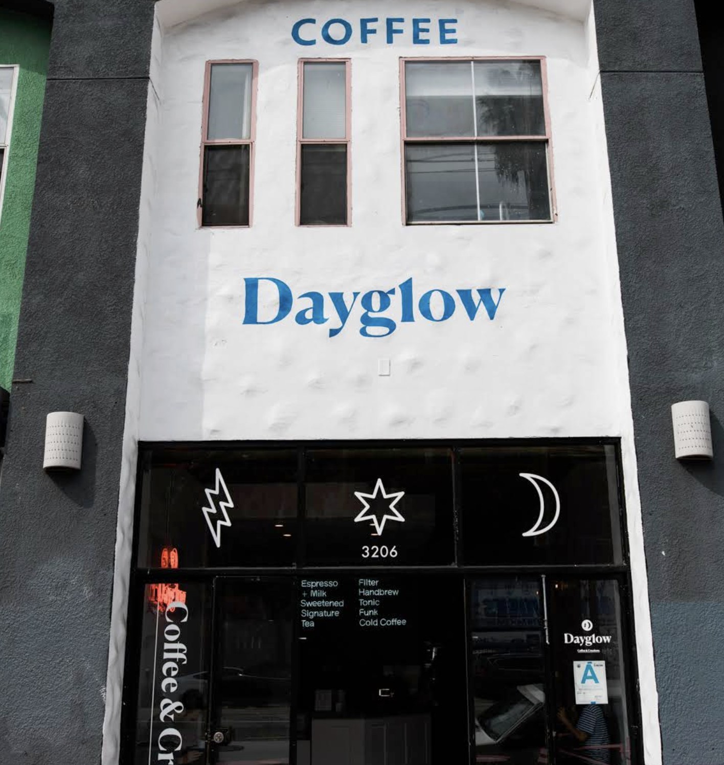 The Silver Lake storefront at Dayglow with the painted sign and neon lit window